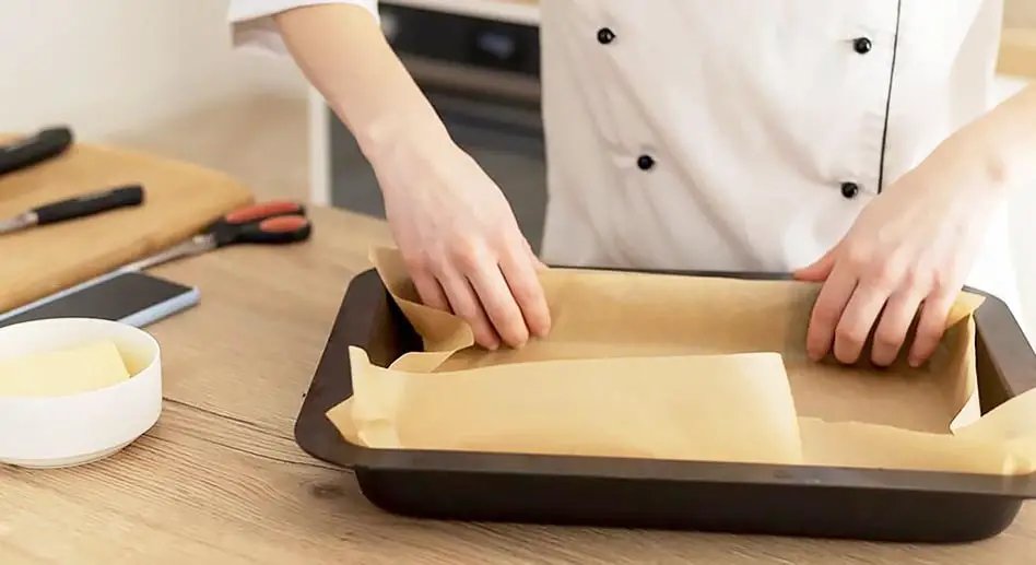 Baking parchment paper is safe to use and it certainly can make your life easier.