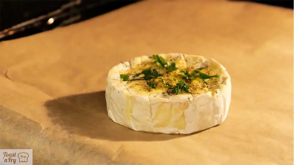 Yes, Camembert cheese can be easily baked in your convection oven without a box or an oven-safe dish of any kind!