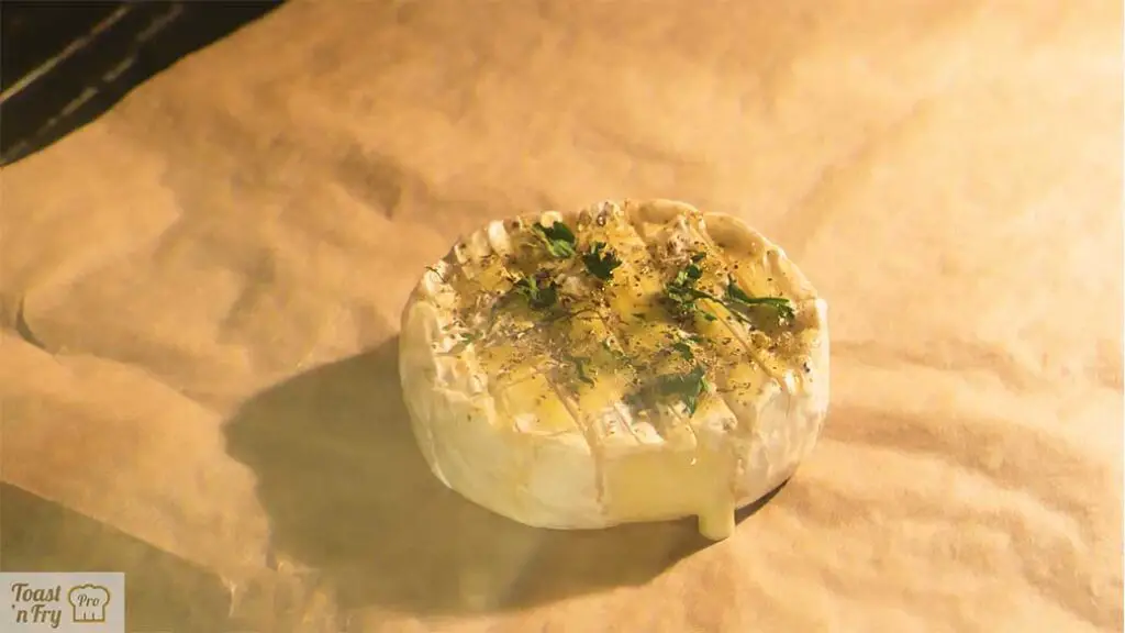 A good sign that your piece of Camembert cheese is ready is when its top surface starts to soften and move just a bit.